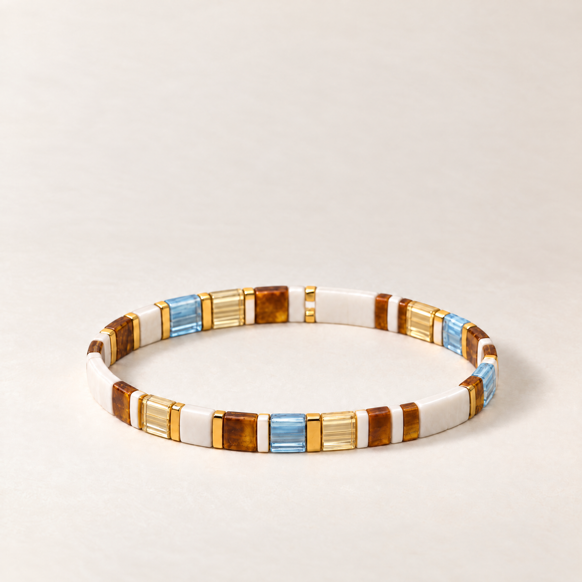 Muse Atelier Candy Tile Bracelet in Amber & Sky, shown on a warm neutral background