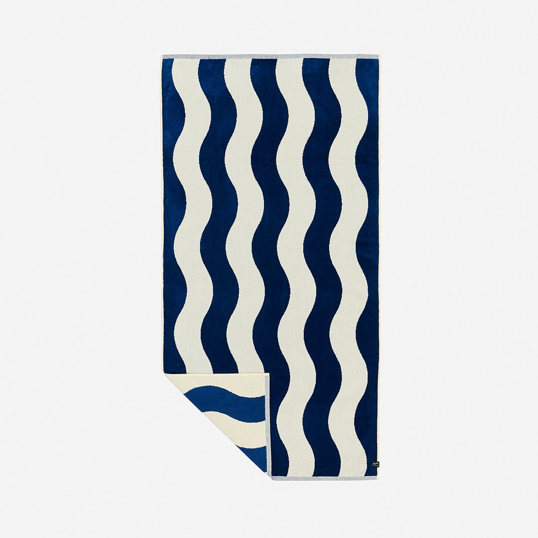 Slowtide Stripe Premium Beach Towel in Deep Pool — hero product view